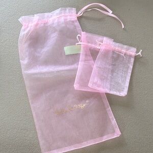 Lilly Pulitzer Pink Sheer Gift Bags with two unnamed pink drawstring pouches